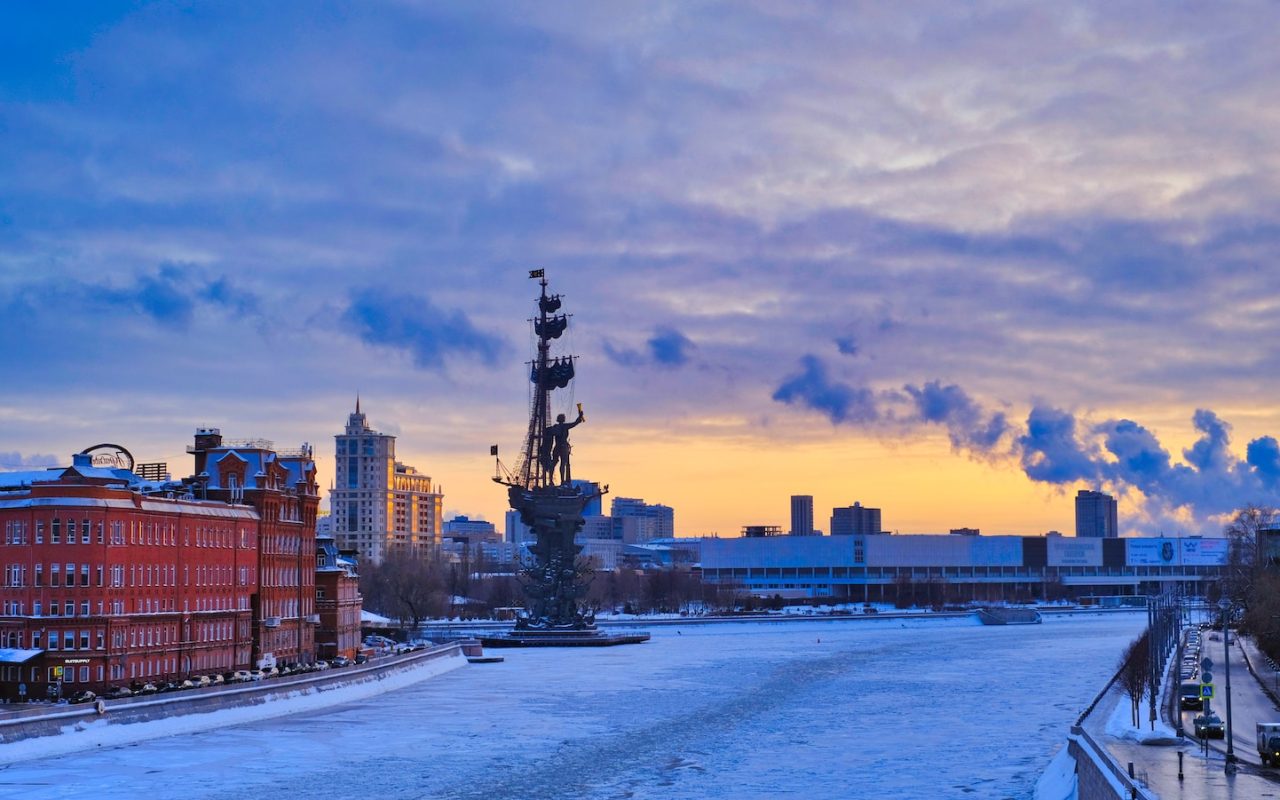 a view of a river with a city in the background