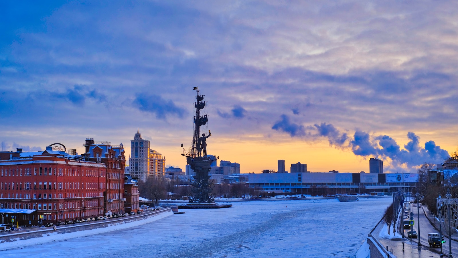 a view of a river with a city in the background